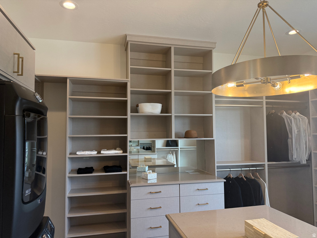 Custom closet system featuring built-in shelving, hanging rods, and integrated drawers
