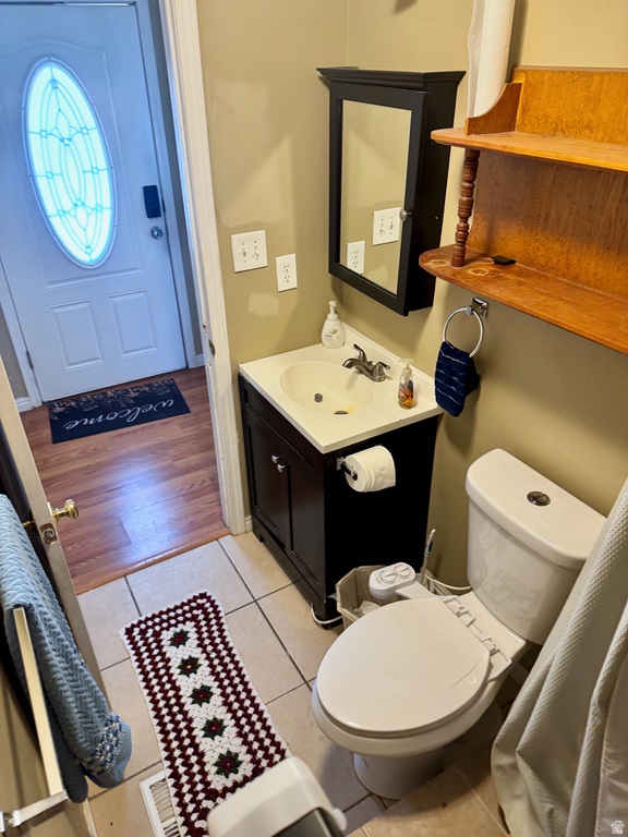 Bathroom with vanity and light tile patterned flooring