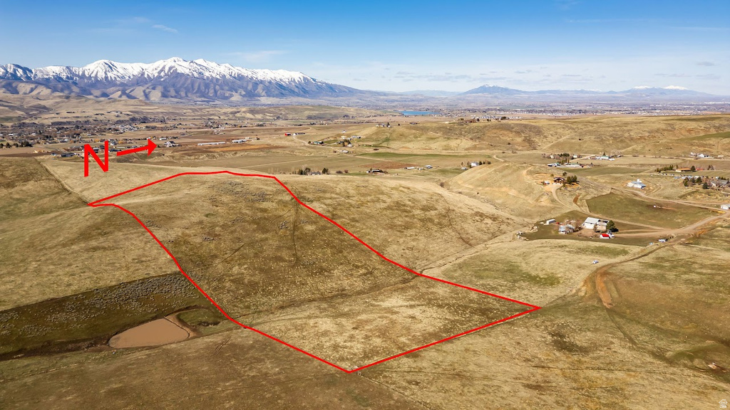 View of rural area with property parcel outlined and mountains