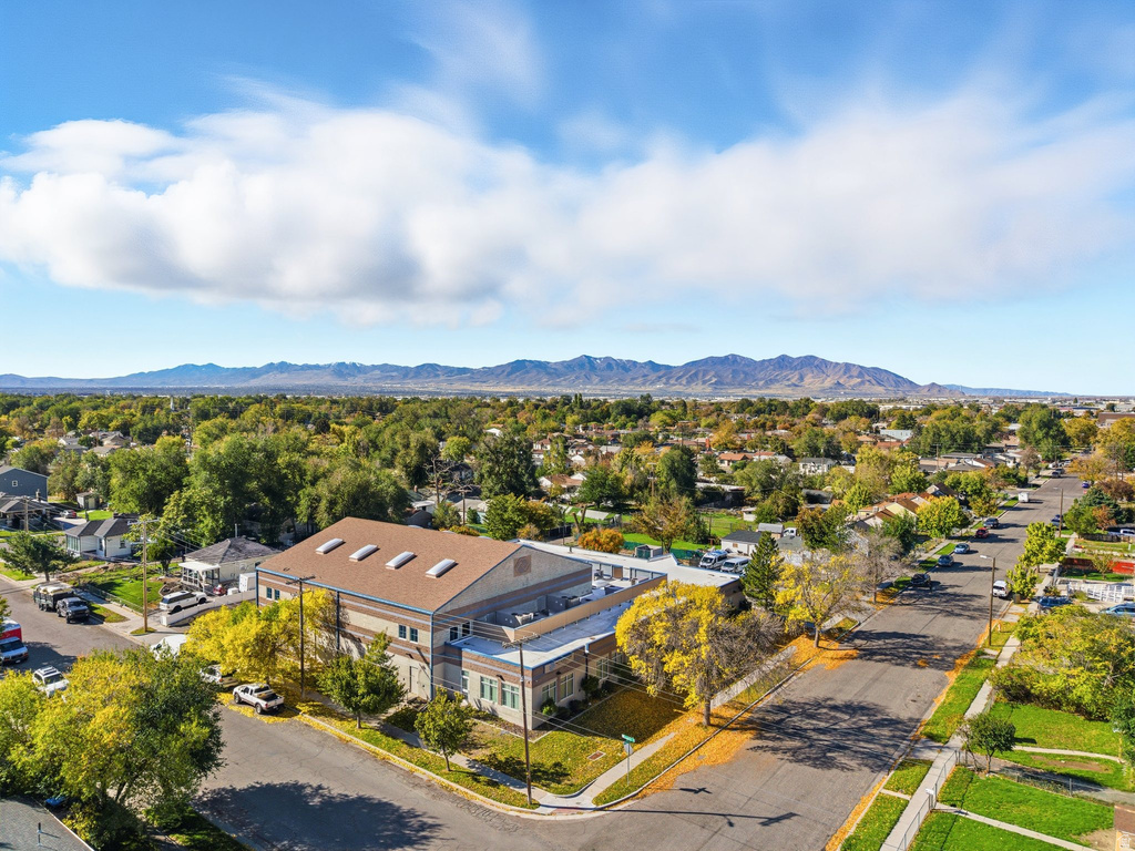 Aerial view of residential area featuring a mountainous background