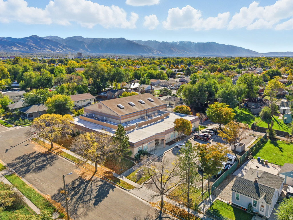 Aerial perspective of suburban area featuring a mountain backdrop