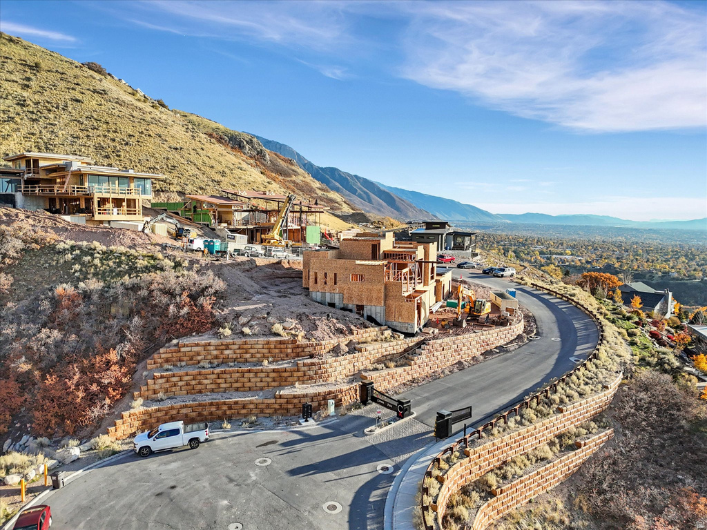 Aerial perspective of suburban area featuring a mountainous background