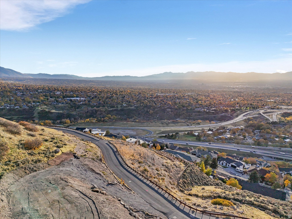 Aerial view of residential area featuring a mountainous background