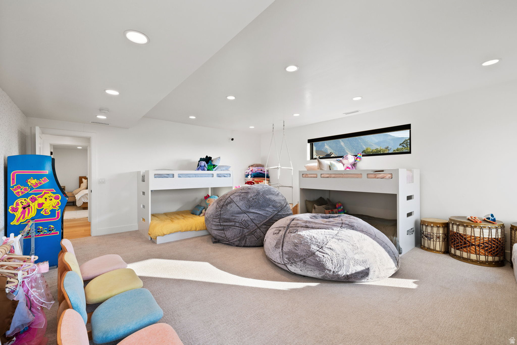 Bedroom featuring light colored carpet and recessed lighting