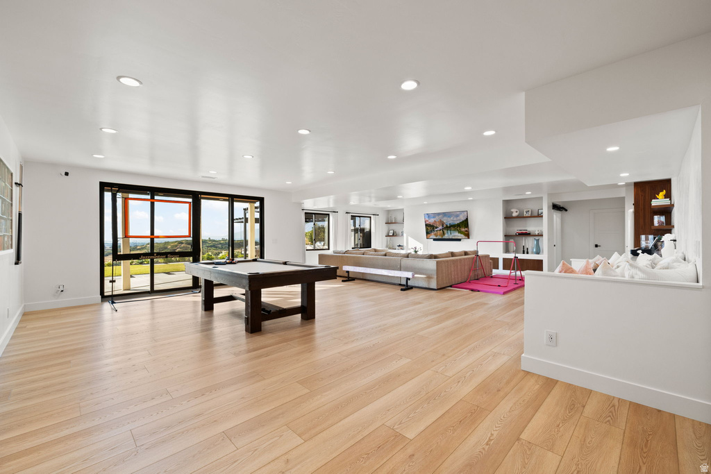 Rec room with light wood-style floors, billiards table, and recessed lighting