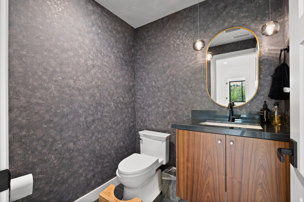 Bathroom with toilet and vanity