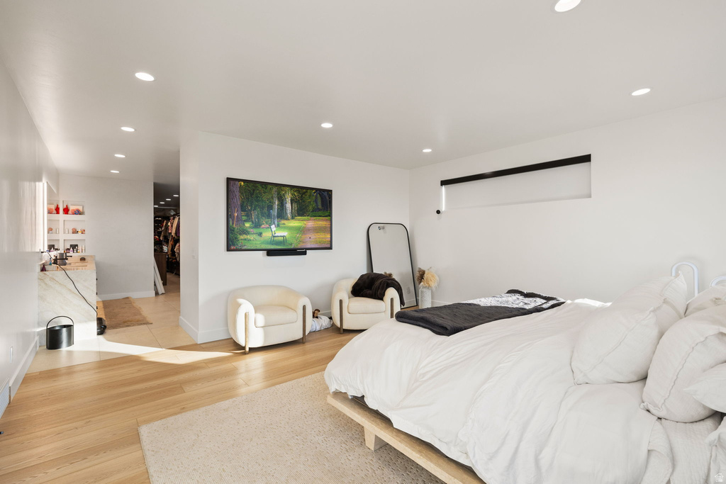 Bedroom with recessed lighting and light wood finished floors
