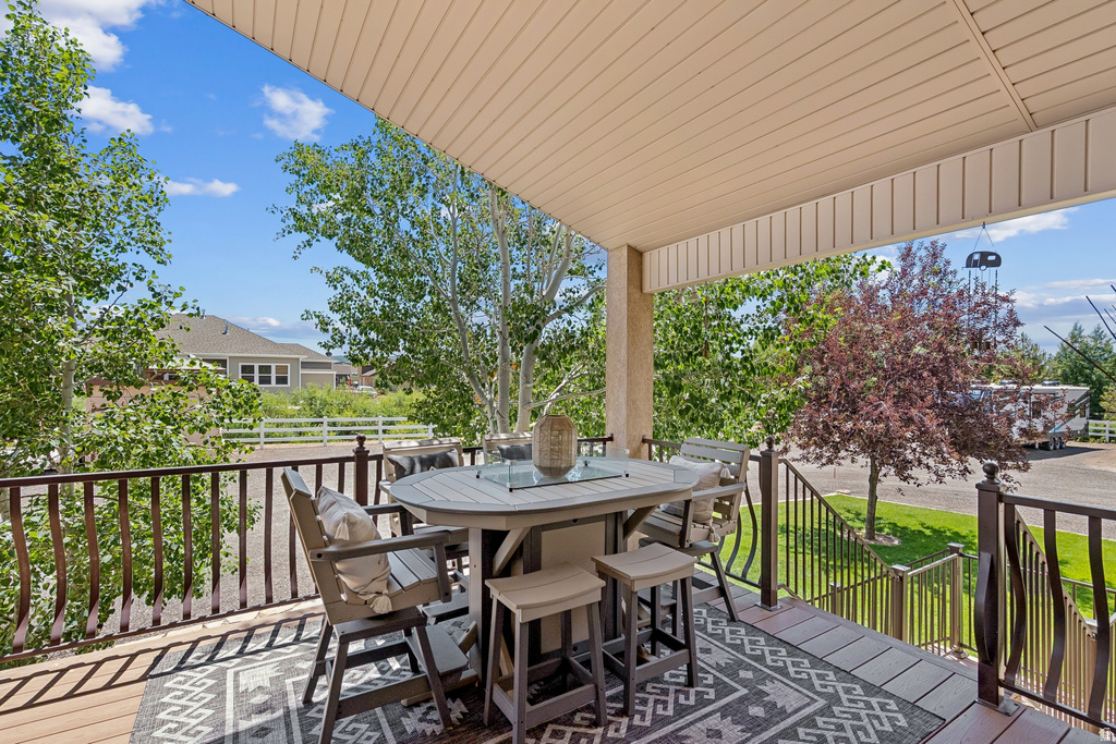 Wooden deck featuring outdoor dining space