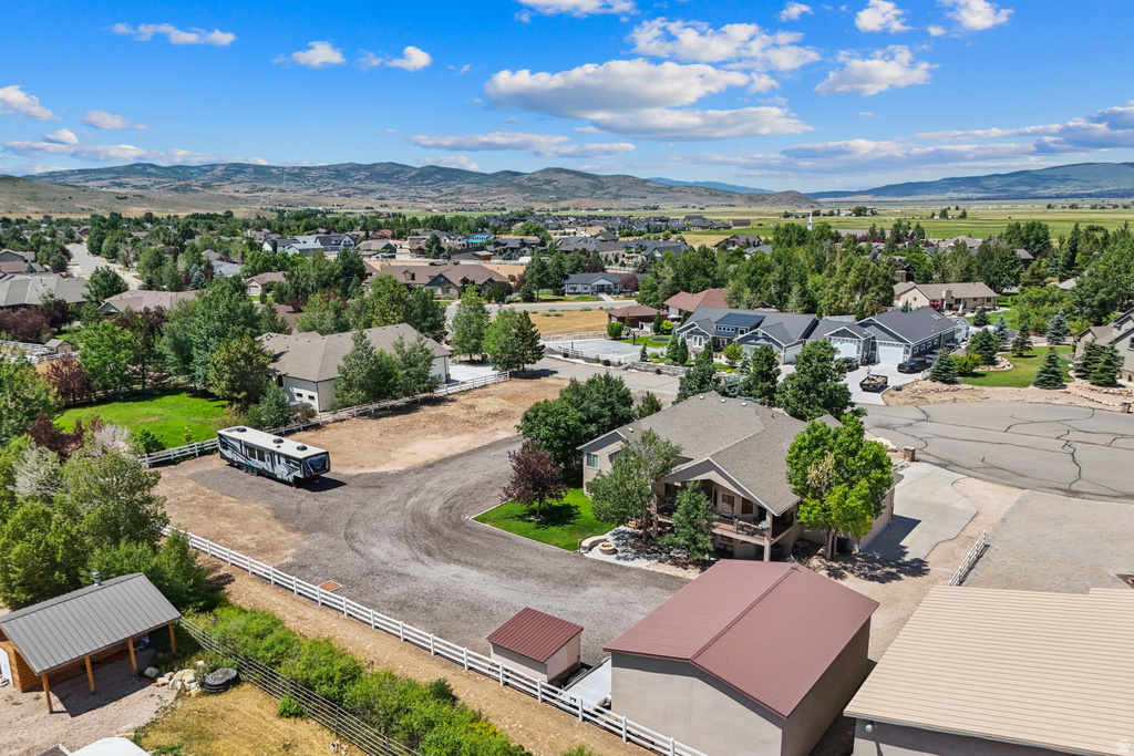 Aerial perspective of suburban area with a mountainous background