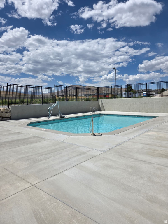 Community pool featuring a patio area