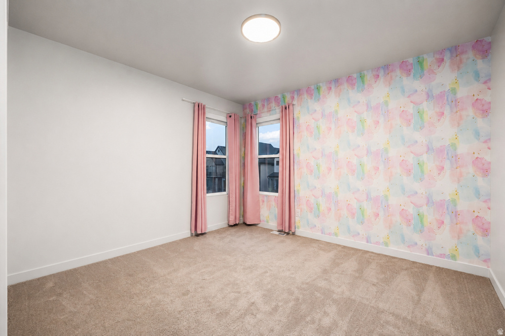Accent wall featuring watercolor-style wallpaper