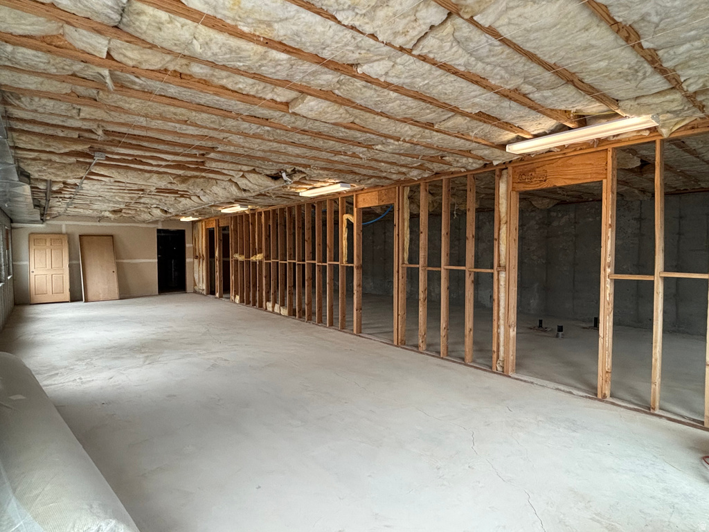 Miscellaneous room with unfinished concrete flooring