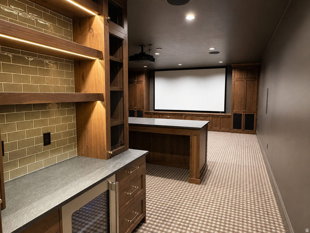 Entertainment space featuring a large projection screen, checkerboard-patterned carpeting, dark wood cabinetry, and recessed lighting