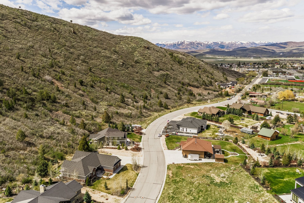Aerial perspective of suburban area featuring a mountainous background