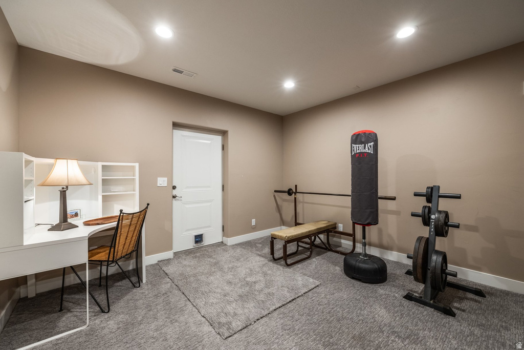 Exercise room featuring carpet flooring and recessed lighting