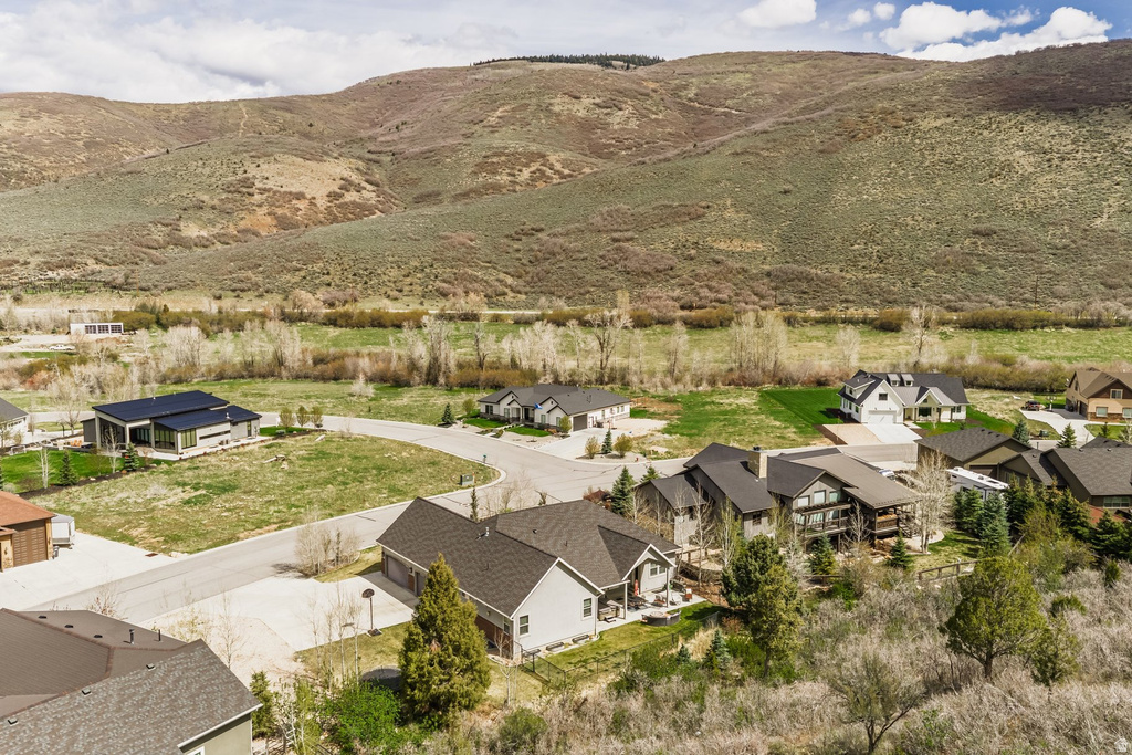 Aerial perspective of suburban area featuring a mountainous background