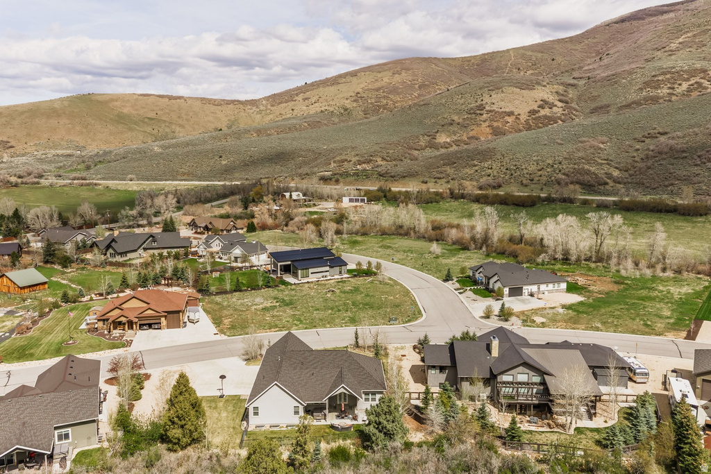 Aerial perspective of suburban area featuring a mountainous background