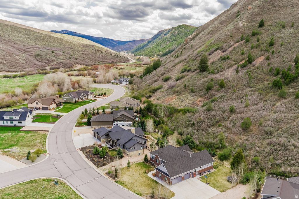 Aerial perspective of suburban area with a mountain backdrop