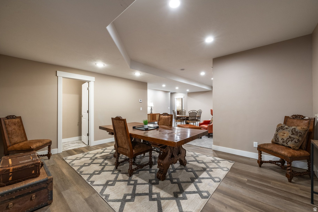 Dining room with recessed lighting and wood finished floors
