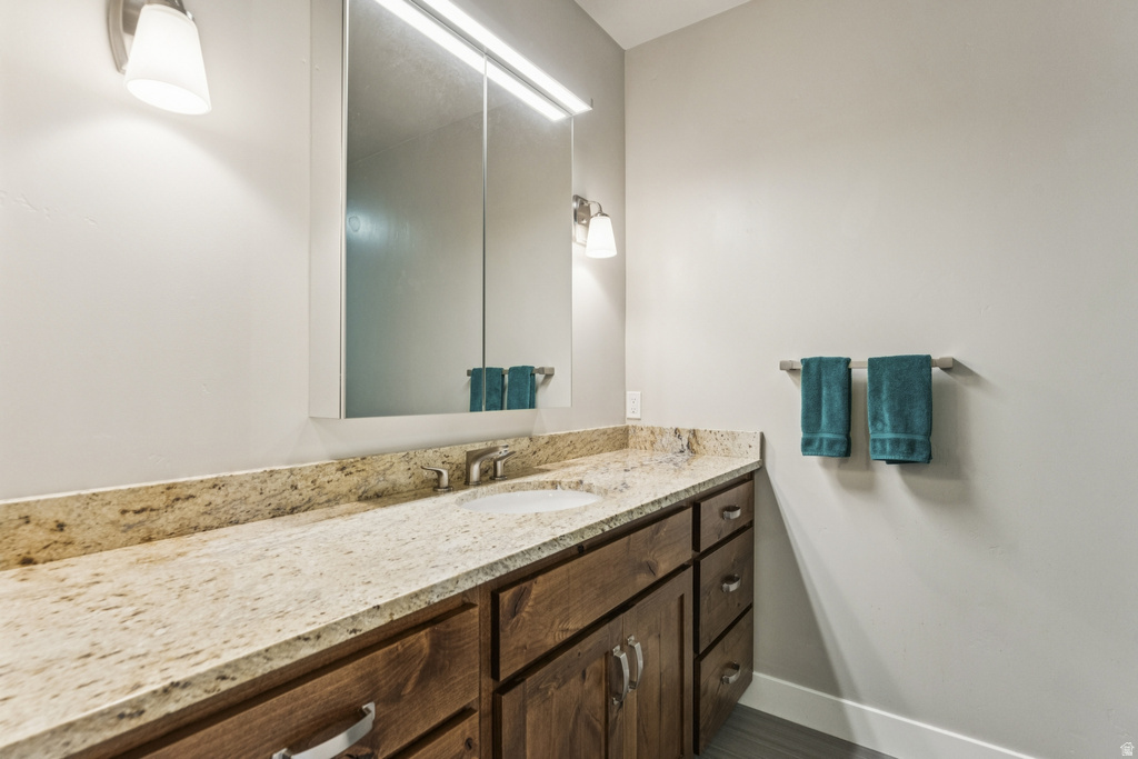 Bathroom featuring vanity and baseboards
