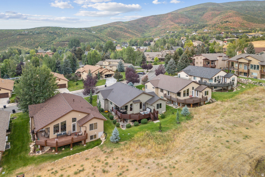 Aerial perspective of suburban area with a mountainous background