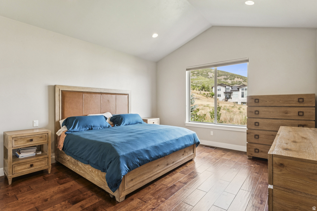 Bedroom with dark wood-type flooring and recessed lighting