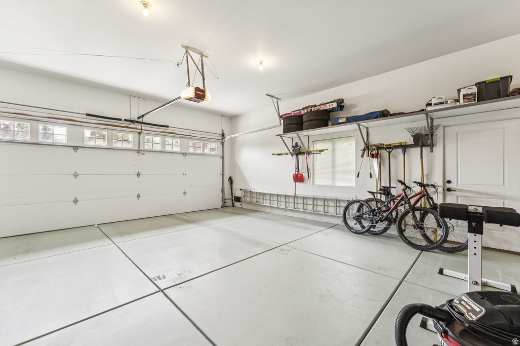 Garage featuring a garage door opener