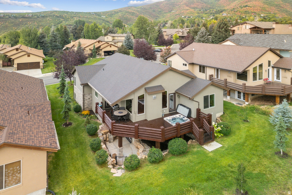 Aerial perspective of suburban area with a mountain backdrop
