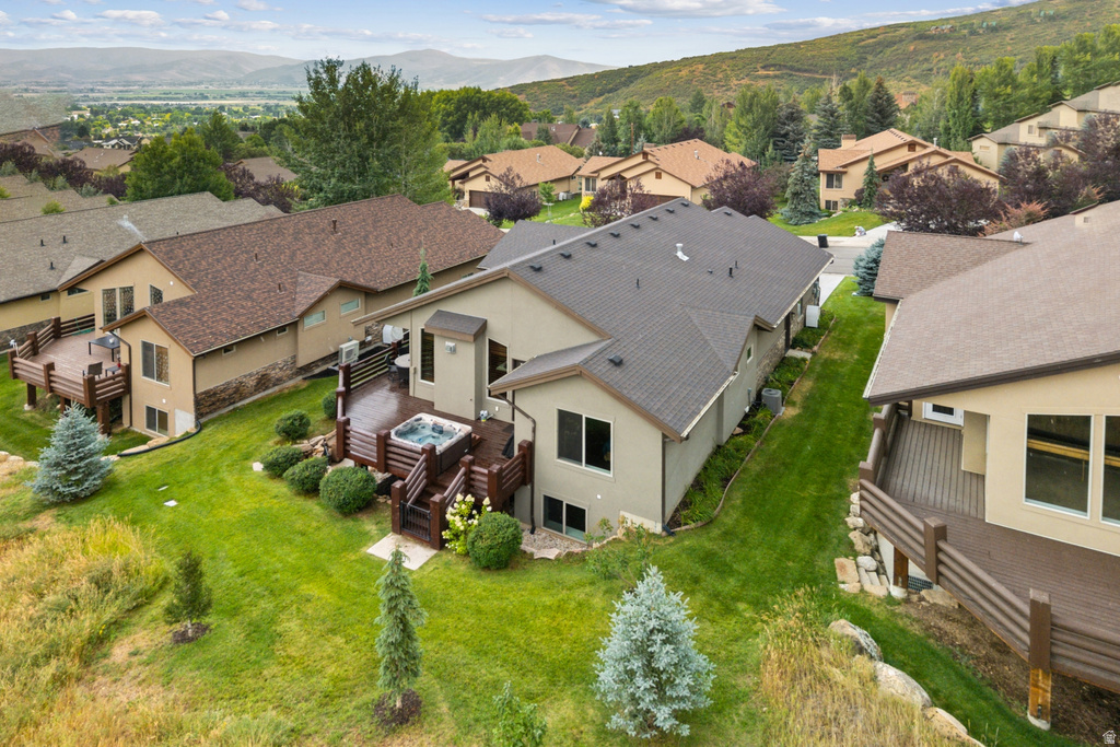 Aerial view of residential area featuring a mountainous background
