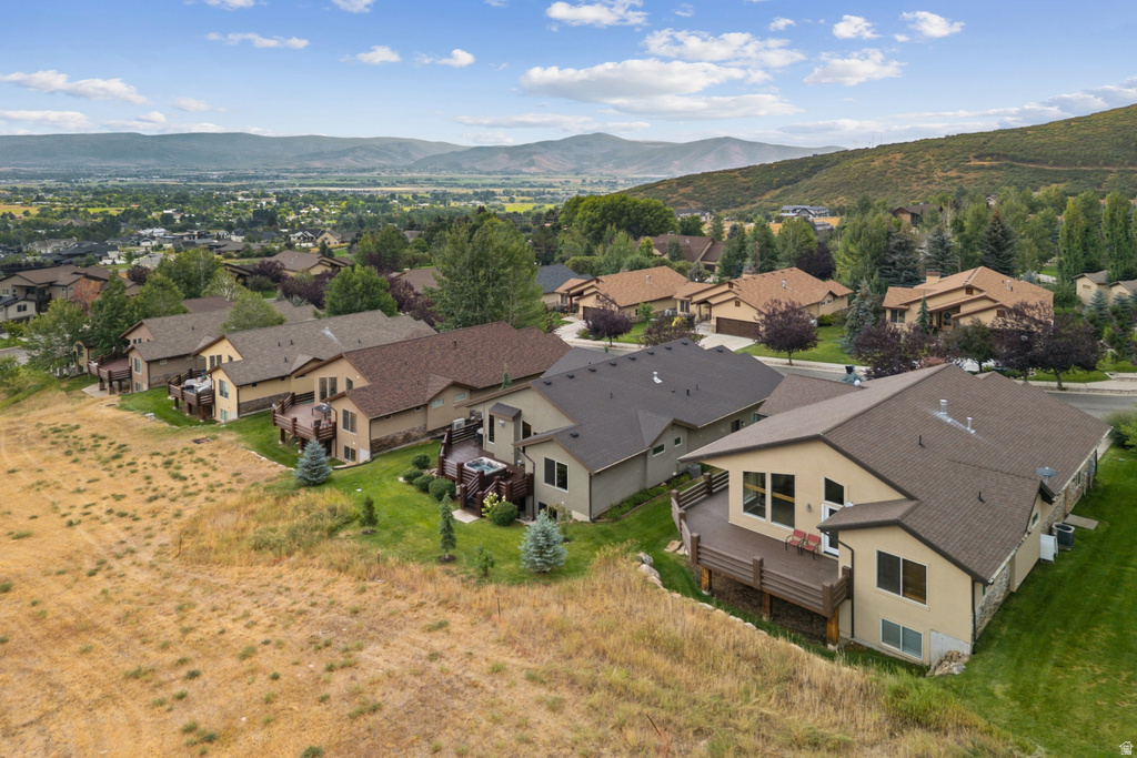 Aerial perspective of suburban area with a mountain backdrop