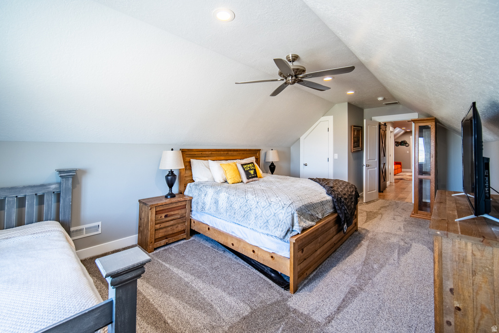 Bedroom with carpet floors, a ceiling fan, and a closet