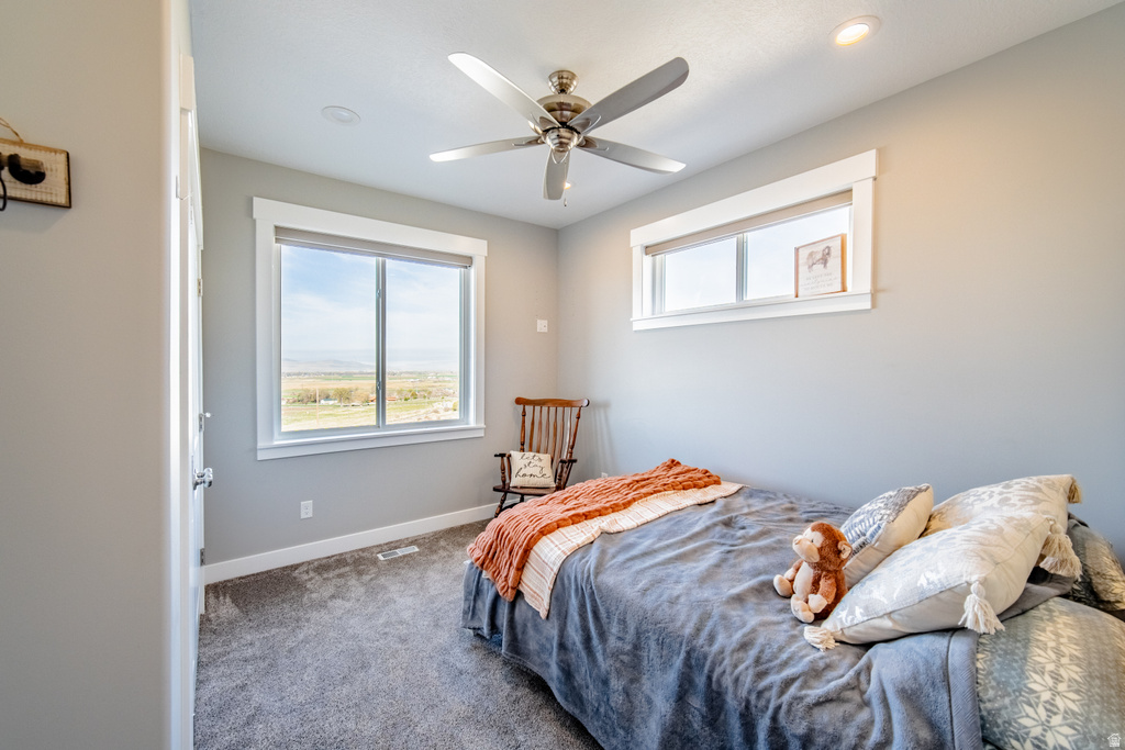 Bedroom with carpet and ceiling fan