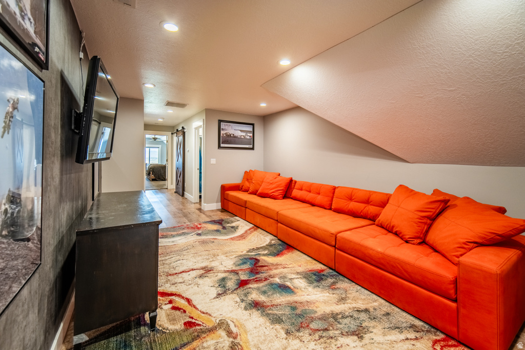 Living area with a textured ceiling and recessed lighting