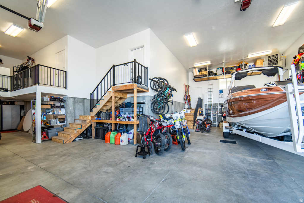 Garage featuring a heating unit and a garage door opener