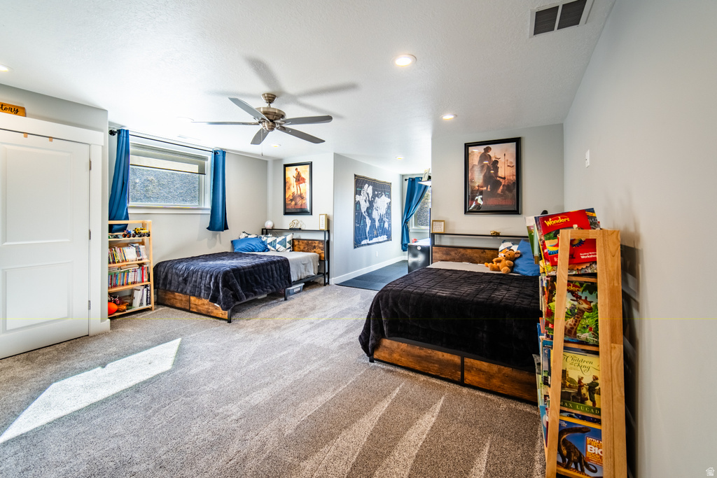 Bedroom featuring a ceiling fan, carpet, and recessed lighting