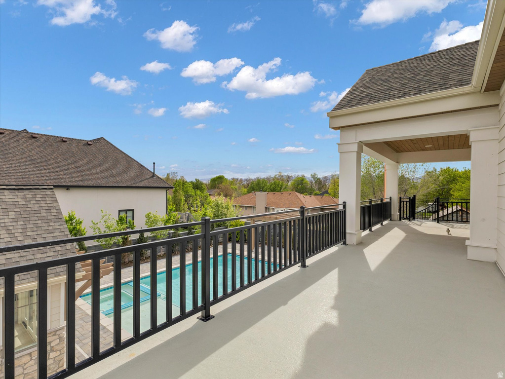 Balcony featuring view of pool