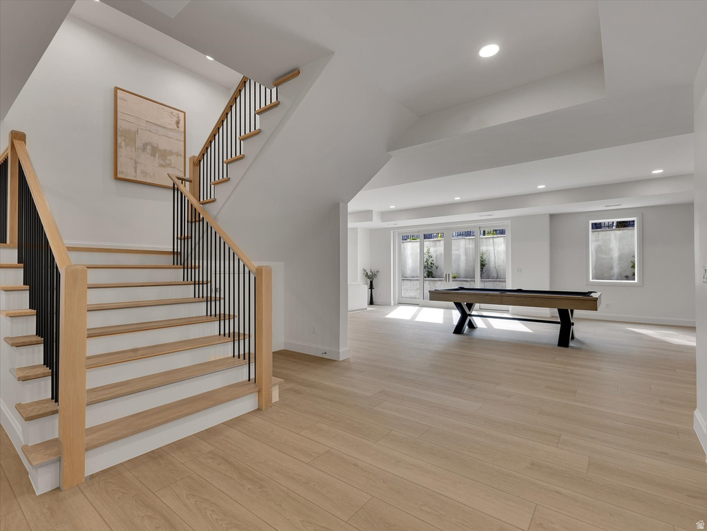 Game room featuring light wood-style floors, recessed lighting, pool table, and french doors
