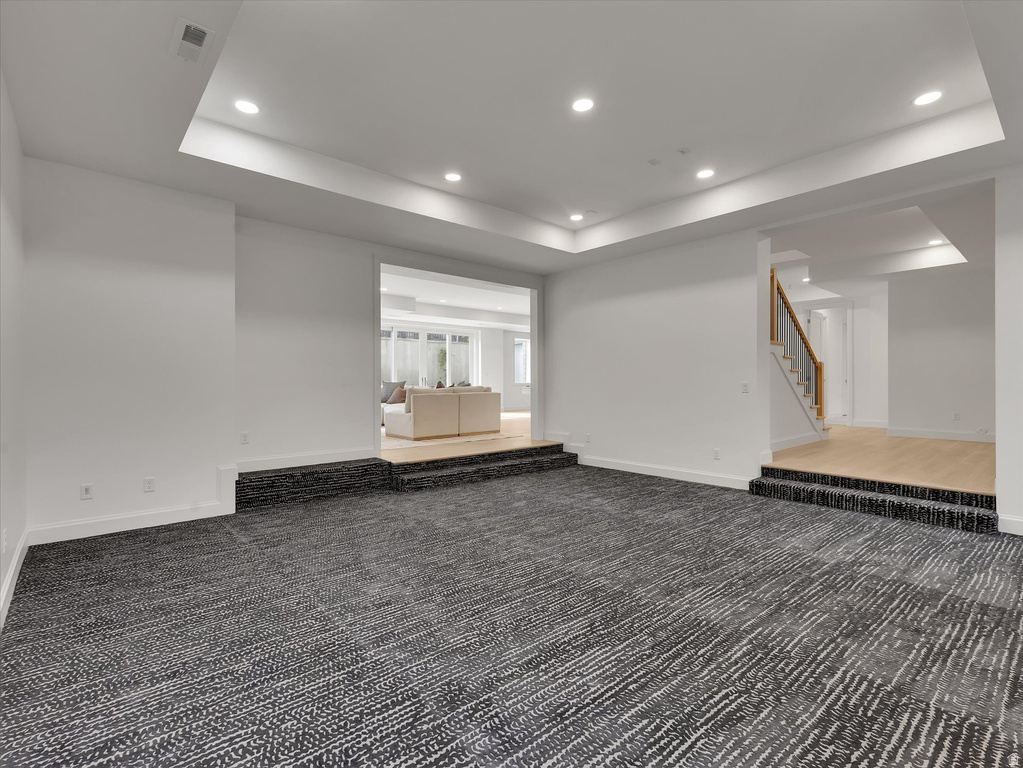 Basement featuring recessed lighting and carpet