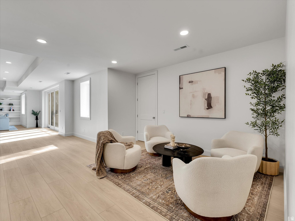 Living area featuring recessed lighting and light wood-style flooring