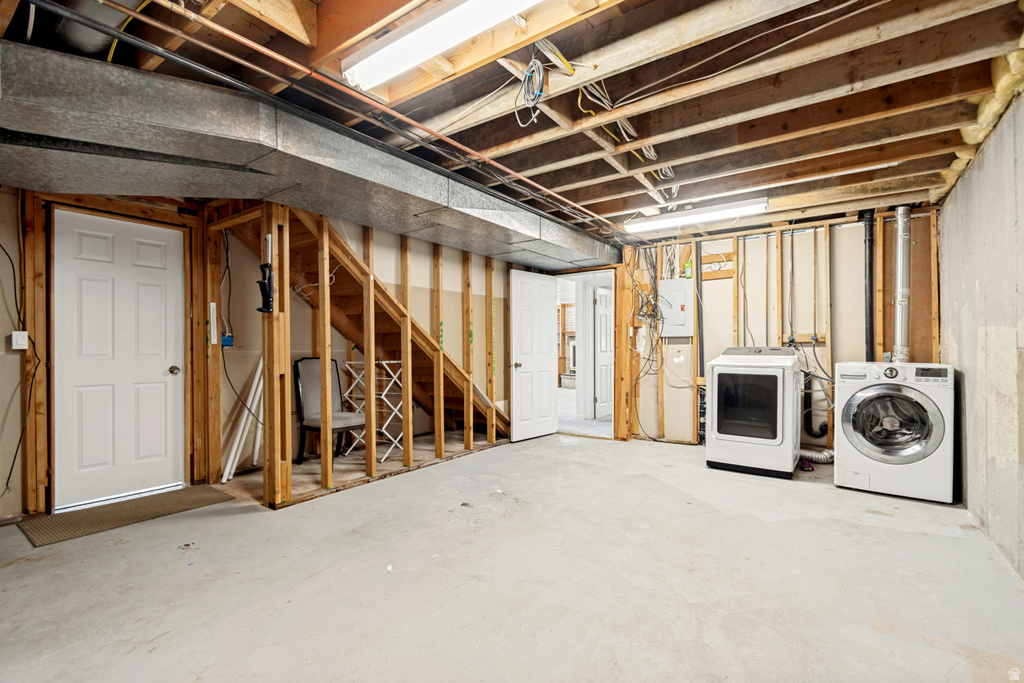 Unfinished basement offering exposed joists and framing, a concrete floor, and an exposed HVAC duct