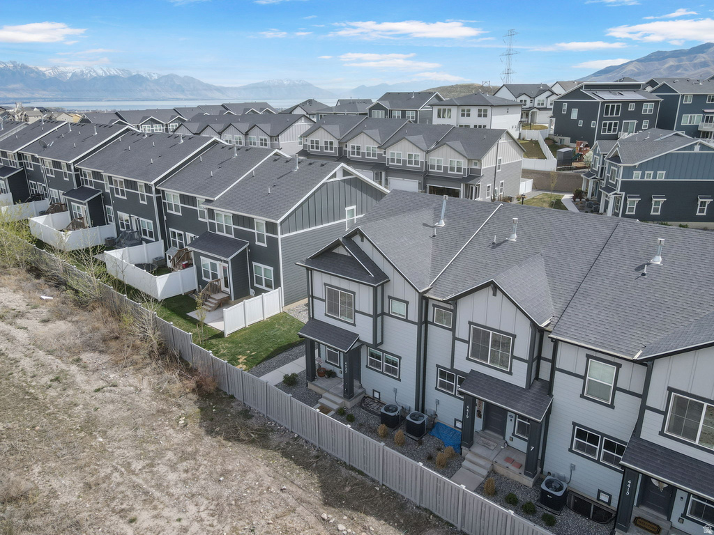 Aerial perspective of suburban area with a mountain backdrop