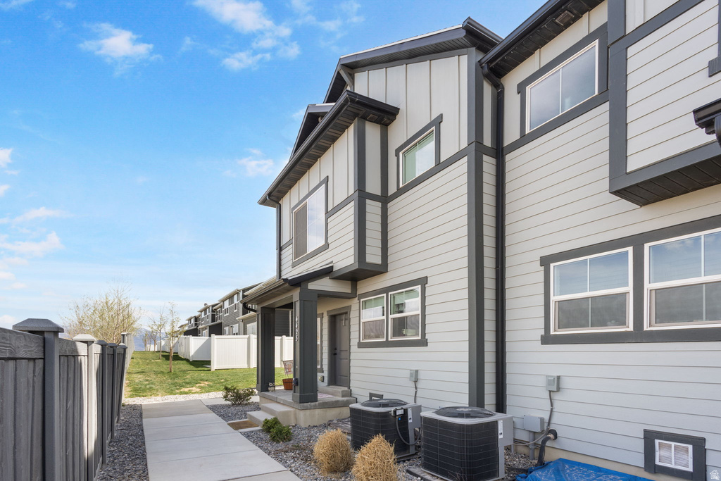 View of home's exterior with a central air condition unit and board and batten siding
