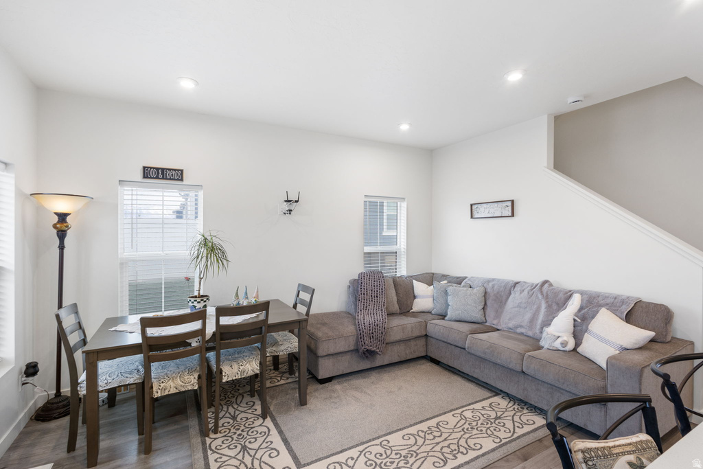 Living room featuring wood finished floors, plenty of natural light, and recessed lighting