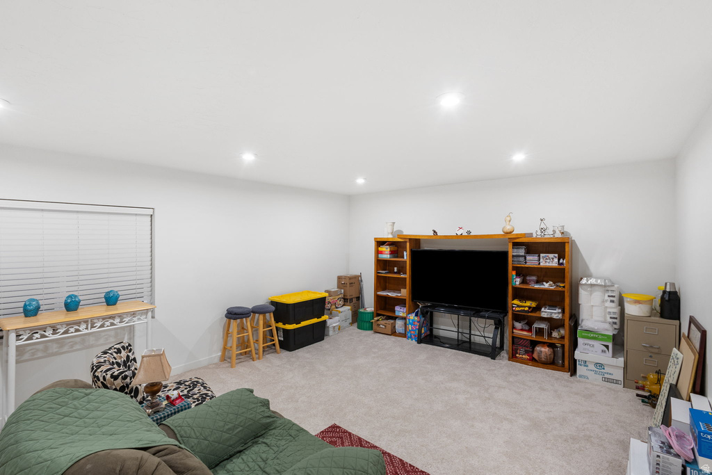 Carpeted living room featuring recessed lighting