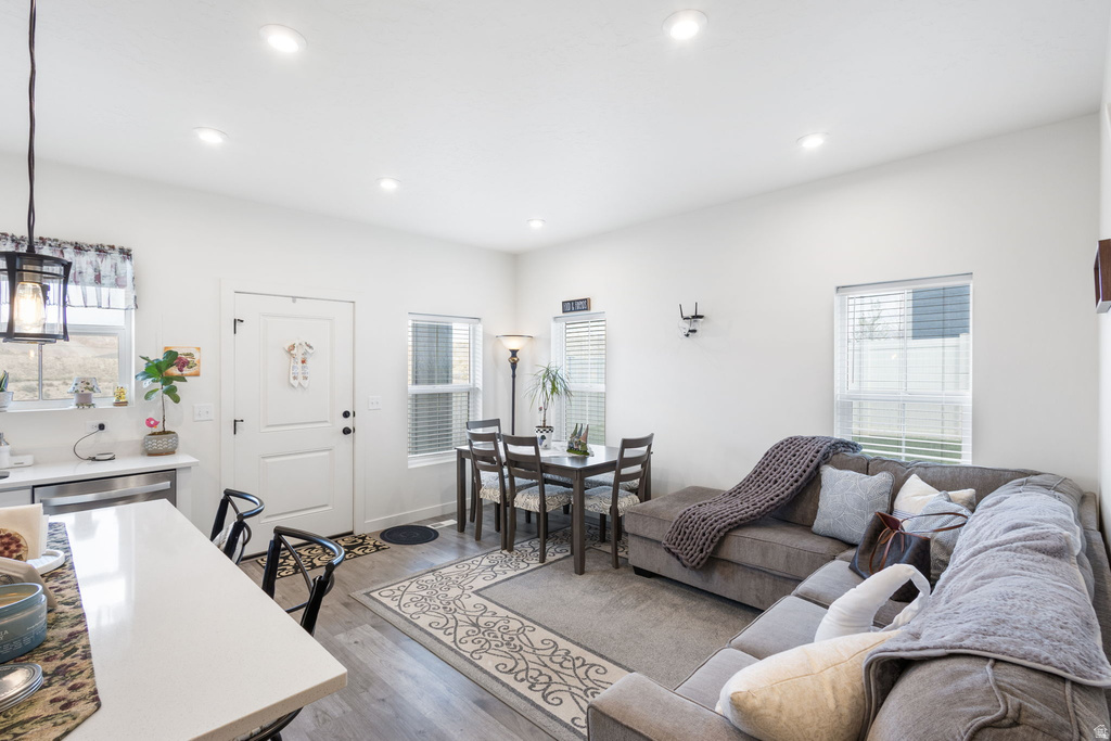 Living area featuring plenty of natural light, light wood finished floors, and recessed lighting