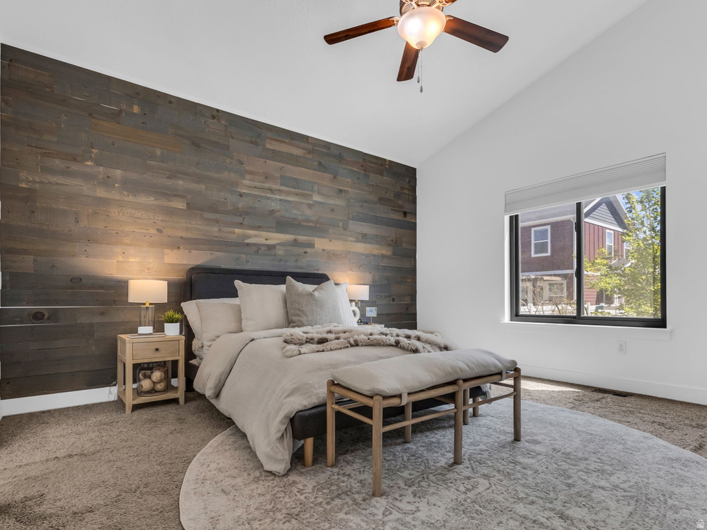 Vaulted ceiling featuring a ceiling fan with integrated lighting