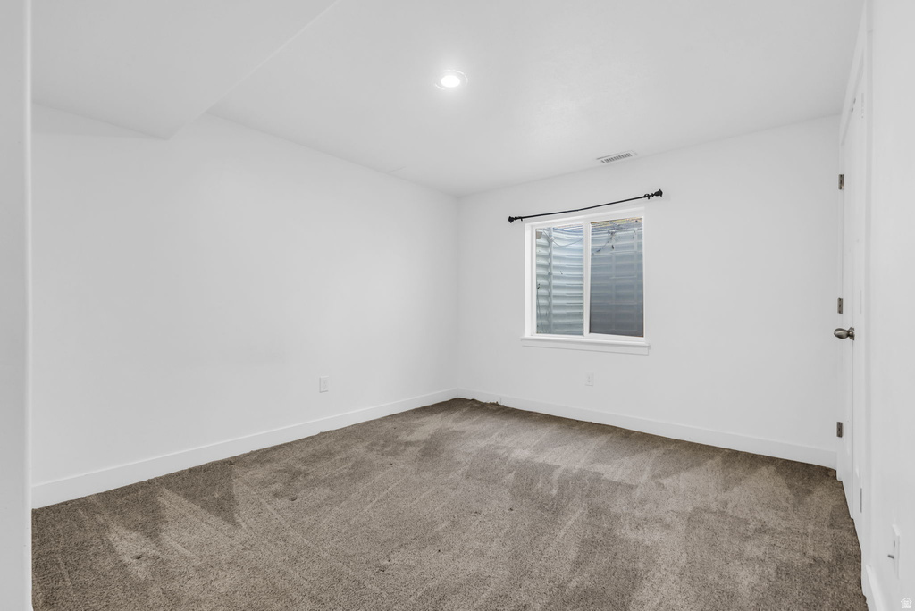 Room featuring neutral carpeting and white walls