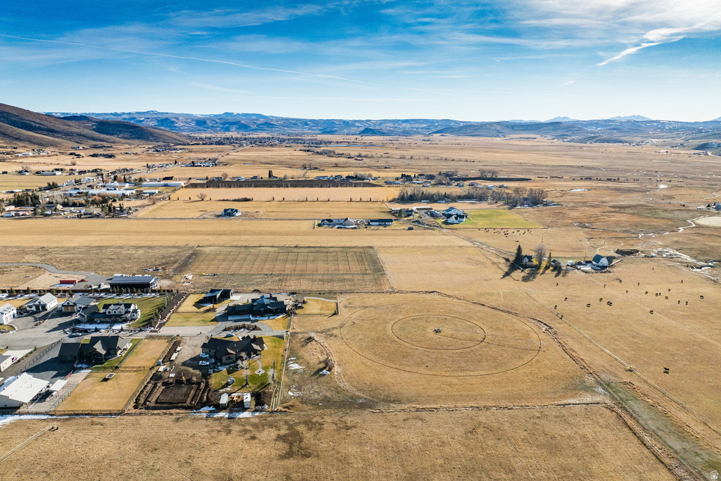Expansive rural property featuring broad fields and scattered residential structures