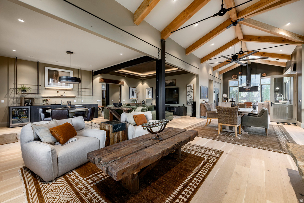 Vaulted ceiling with exposed wood beams and central fan