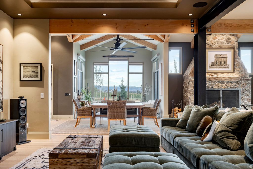Open-concept living area with light wood-finish flooring